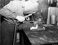 An Electrical Artificer doing arc-welding in the Electrical Artificers' Workshop, H.M.C. Dockyard, Halifax, Nova Scotia, Canada, 18 November 1942 November 18, 1942.