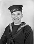 Stoker First Class Warren Stevens, R.C.N.R., who survived the sinking of the armed merchant cruiser H.M.S. JERVIS BAY in 1940. Halifax, Nova Scotia, Canada, 21 January 1943 January 21, 1943.