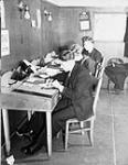 Personnel writing letters at the North End Services Canteen, Halifax, Nova Scotia, Canada, 6 February 1943 February 6, 1943.