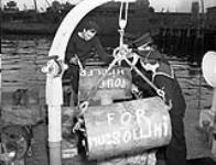 [Personnel handling depth charges aboard unidentified FAIRMILE manned by the Free French Naval Forces.] 6 Feb. 1943