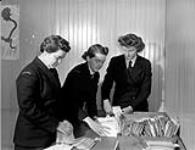 Personnel of the Women's Royal Canadian Naval Service (W.R.C.N.S.) sorting mail at the Fleet Mail Office, Halifax, Nova Scotia, Canada, 3 March 1943 March 3, 1943.