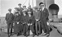 Officer with members of the Winnipeg Falcons Hockey Team, aboard the Melita en route to the VII Olympiade,Belgium 1920