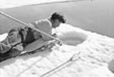 Anijah at fishing pole in ice near Spence Bay juin 1951.
