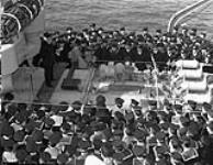 Vice-Admiral Percy W. Nelles, Chief of the Naval Staff, addressing the Ship's Company of the destroyer H.M.C.S. ATHABASKAN, Plymouth, England, 14 April 1944 Apri1 14, 1944.