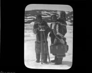 Two women (one with child) with surveying or filming equipment (JBD-108) 1913-1914.