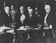 Rt. Hon. R.B. Bennett signing commercial agreement with France October 1934
