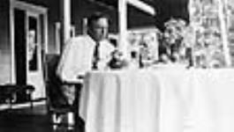 W.L. Mackenzie King on the verandah of Kingswood Cottage 1920 - 1930