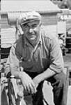 Yugoslav anton "Tony" Stancic employs six his 70-ton salmon seiner "Reel Fisher," part of British Columbia`s salmon fishery Aug. 1945