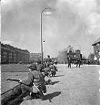 Infantry of the Essex Scottish Regiment guarding one of the main streets of Groningen, Netherlands, 14 April 1945 April 14, 1945.