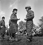 Pipe Major R. Stoker and Sgt. T. Allen, Essex Scottish Regiment, Groningen, Netherlands, 17 April 1945 April 17, 1945.