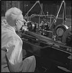 Engraver Thomas Shingles at the Dimension Reducing Machine Royal Canadian Mint Sept. 1955