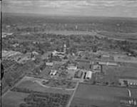 Aerial view of [Central Experimental Farm, Ottawa, Ontario] looking East, from Ash Lane to Dow's Lake and showing all buildings from Dairy Technology to the Central lower Plant 8 Ot. 1963