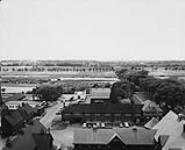 Engineering Research Building, (West) Cattle Barns, large Animal Laboratory and Piggeries, [taken east from Water Tower, Central Experimental Farm, Ottawa, Ontario] 28 June 1961
