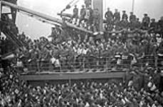 Canadian soldiers aboard a troopship arriving at Greenock, Scotland, 31 August 1942 August 31, 1942.