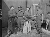 Sgts. Frank Shuster, Johnny Wayne, Captain E.C. Loveridge and J.J. Foy, Toronto at Canadian Army Show 30-Jul-44