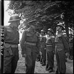 Lieut. Gen. Crerar with Lieut. J. D. Stewart, Brampton, Ont., inspecting Guard of Honour at Dominion Day Celebration at 3 Div. Headquarters 29 June 1944