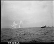 H.M.C.S. LANARK fires pattern of squid 18-Jul-56