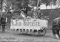 St. Jean Baptiste Day parade float - on banner (St. Jean-Baptiste) 1927