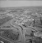 Aerial view looking southeast along Highway 417 from intersection of the Queensway and Highway 417 May 1976