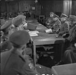 Surrender of German forces in the Netherlands, 1st Canadian Corps Headquarters. General Reichilt is 2nd from left on right side of table 5 May 1945