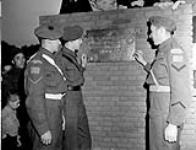 Canadian soldiers examining the Memorial Park Plaque, Ede, Netherlands, 7 November 1945 November 7, 1945.