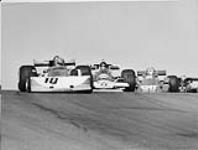 Four Into Four: Ronnie Peterson leads James Hunt, Patrick Depailler and Mario Andretti into the treacherous fourth corner. Formula One cars are travelling about 230 km/hr at this point 1976