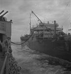 Refuelling at sea of H.M.C.S. UGANDA (left) from a tanker of the British Pacific Fleet Train June 1945