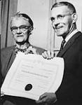 Presentation of certificate of merit for outstanding contributions to local history. Mrs. James Haggerty, President, Federated Women's Institutes of Canada; Lt. Col. T.M.Hunter, English Secretary, Canadian Historical Society 1962