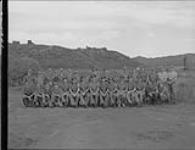 Group portrait of all officers and non-commissioned officers (NCOs) of the Canadian pay units in Korea 18 Sept. 1952