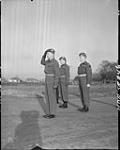 Lt. Col. F.M. Griffiths at the saluting base with Lt. D.H. Struck and Lt. Col. R.D. Hodgins (present Commanding Officer of the Highlanders Light Infantry) 30 Nov. 1945