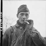 17 year old cigar smoking German paratrooper made prisoner after 2nd Canadian Infantry Division took over town 28 Feb. 1945