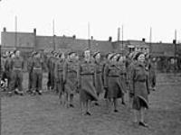 Nursing sisters of No.5 Casualty Clearing Station, Royal Canadian Army Medical Corps (R.C.A.M.C.), led by Captain M.M. Kellough, taking part in an Easter church parade, Oss, Netherlands, 1 April 1945 April 1, 1945.