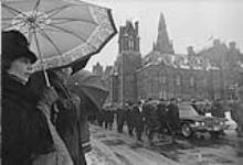Lester B. Pearson Funeral procession leaving Parliament Hill on way to Christ Church Cathedral. Prime Minister P.E. Trudeau is at left of the hearse. Ottawa, Ont., 31 Dec. 1972 31 Dec. 1972