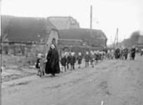 Dutch children under the care of nuns arriving for a party given by The Argyll and Sutherland Highlanders of Canada (Princess Louise's), Elshout, Netherlands, 17 December 1944 December 17, 1944.