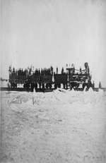 Engine and cars of the Quebec, Montreal, Ottawa and Occidental Railway Co. (Q.M.O. & O.) crossing the St. Lawrence River on railway laid over the ice ca. 1870-1880's