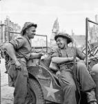 Sergeants C.V. Hebner and J. Cormack in their jeep, Falaise, France, 17 August 1944 August 17, 1944.