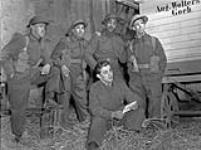 Members of the Bandoliers unit of the Canadian Army Show entertaining personnel of the 3rd Canadian Infantry Division in a barn near Udem, Germany, 8 March 1945 Marh 8, 1945.