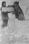 [Two men building an igloo, N.W.T.] [graphic material] 1933