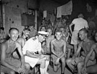 Canadian and British prisoners-of-war liberated by the boarding party from H.M.C.S. PRINCE ROBERT, Hong Kong, August 1945 August 1945.