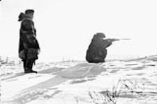 Inuit hunter using rifle 1950