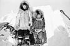 Two Inuit Children Stand in Front of Snowhouse 1949 - 1950