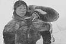 [Tiktaq and baby Aksakyuaq .] 1949-1950