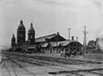 Toronto Union Station before construction of the trainshed extension. View looking northwest from the York Street level crossing ca. 1885