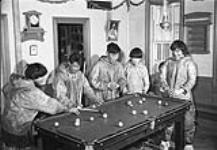 Inuit men playing pool 1950.