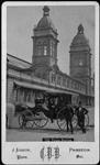 Union Station with three gentlemen and landau carriage in foreground ca. 1875