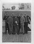 Group photo taken aboard S.S. MEGANTIC.(L-R):W. Howard Measures,George Hambleton,Stanley Cudmore,Jean Desy,L.Clare Moyer,Philippe Picard,Dr.O.D.Skelton Oct. 1926