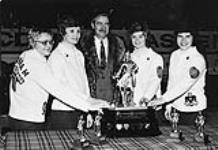 Members of the Saskatchewan rink and Mr. David Macdonald Stewart with the "Lassie" trophy, Canadian Ladies Curling Association Championships of 1974 1974