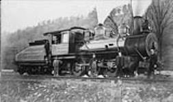 Loco No. 40 of the Toronto, Hamilton and Buffalo Railway Company. (L-R in locomotivemotive): Leo Morrison, Frank Dean. (L-R on ground): William Aspden, James Dingle, --, Jack Hogan n.d.