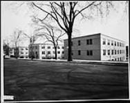 CONSTRUCTION OF TEMPORARY OFFICE BUILDING NO.6. View of buildings from Mackenzie street 7 May 1942