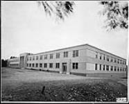 Construction of temporary Office Building No. 7. Exterior view of completed building 10 July 1942
